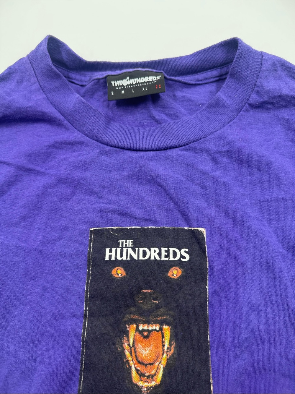 The Hundreds Purple Tee with Black Graphic and Orange Accents